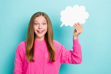 Photo of excited teenager open mouth shocked hold paper cloud unexpected genius idea solution problems isolated on blue color background