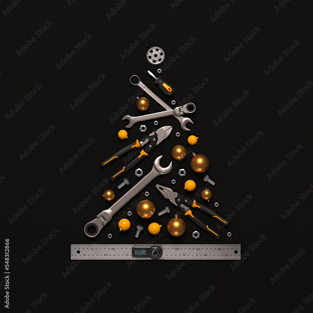 A symbolic Christmas tree made of construction tools on a black ...