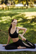 © Ankor_stock. - Young woman in sportswear doing leg stretching in the city park.