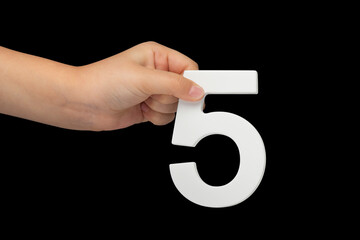 Aufkleber - Number five in hand isolated on black background. Number five in the hand of a child holding on a black background. To be inserted into a project or design.