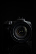 © Jiri Hera - Digital mirrorless camera on black background. Lens closeup. Front view.