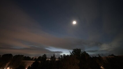 Poster - time lapse of the morning sky with moon and clouds