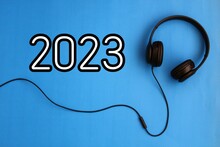 Happy New Year 2023. Year 2023 With Headphones. Creativity Inspiration, Planning Ideas Concept. Colorful Background