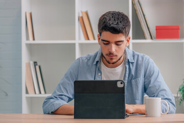 Poster - young man at home or student with laptop or tablet