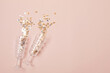 © netrun78 - Champagne or sparkling wine glasses with confetti over pink background. Christmas, new year party, birthday or wedding celebration idea. Top view, flat lay, copy space