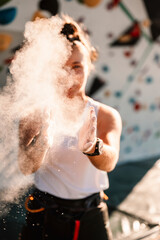 Wall Mural - Climber wearing in climbing equipment. Practicing rock-climbing on a rock wall outdoor. Xtreme sports and bouldering concept.  rock climber climbs on a rocky wall.