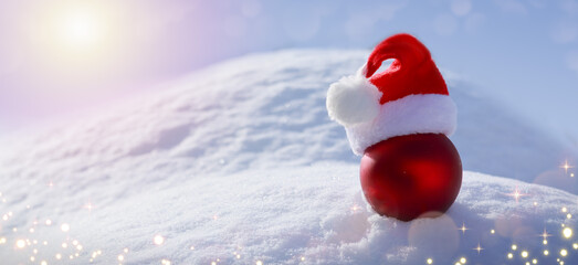 Wall Mural - christmas background with red ball on white snow.