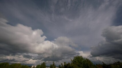 Wall Mural - Summer clouds on a blue sky on a sunny day. timelapse