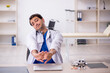 © Elnur - Young male doctor working in the clinic