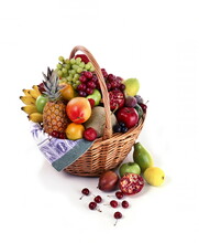 Wicker Basket With Various Colorful Fruits On White Background