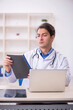 © Elnur - Young male doctor working in the clinic