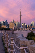 Waterfront Path Leading To A Colorful Pink Sunset Above The Toronto Skyline. Trillium Park 