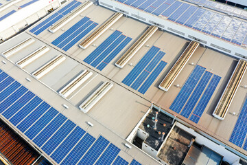 Wall Mural - solar panels on factory rooftop