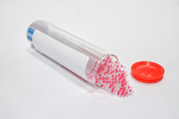 Micro hematocrit tube on white background.