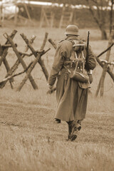 Wall Mural - Members of  history club wear historical German uniform during historical reenactment of WWII 