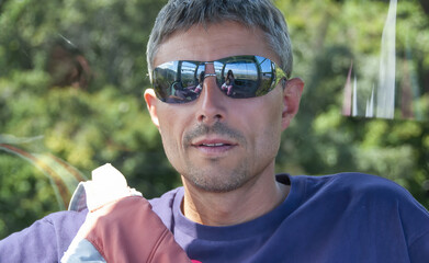 Sticker - Portrait of a happy caucasian man relaxing during a hike in the forest