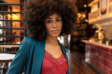 Hispanic Businesswoman With Afro At Coworking
