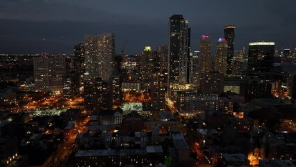 Sticker - Aerial video of night new york city with skyscrapers and other buildings lit by lanterns