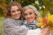 © aletia2011 - Portrait of an elderly woman with her daughter in autumn.