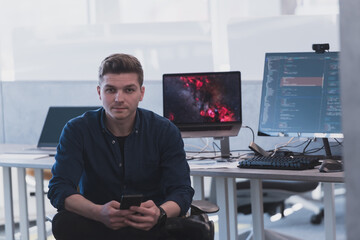 Programming. Man Working On Computer In IT Office, Sitting At Desk Writing Codes. Programmer Typing Data Code, Working On Project In Software Development Company