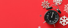 Stylish Alarm Clock And Snowflakes On Red Background With Space For Text