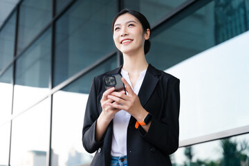 Wall Mural - Portrait of a beautiful young Asian businesswoman at the company