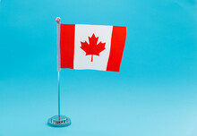 Canadian Table Flag Waving On Blue Background