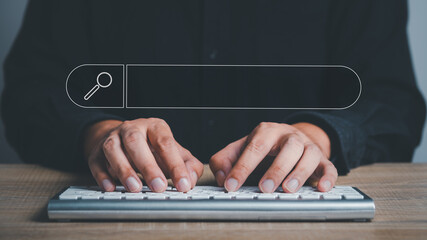 man's hands are using a computer keyboard to Searching for information. Using Search Console with your website. Data Search Technology Search Engine Optimization. Online business search a job for work