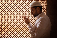 Portrait Of A Muslim Man Praying At Home