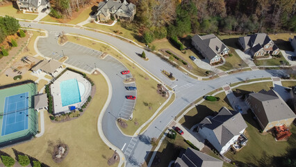 Wall Mural - Row of two story new development houses with recreational tennis court and swimming pool in upscale neighborhood suburbs Atlanta, Georgia, USA