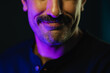 © ADDICTIVE STOCK - Crop face of man with mustache against black background