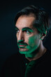 © ADDICTIVE STOCK - Serious man with mustache on black background