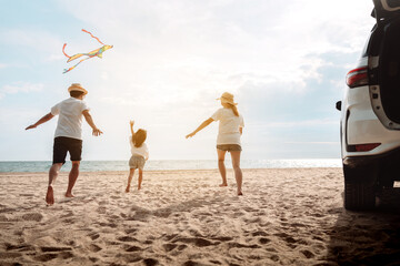 Wall Mural - Happy Family with car travel road trip. summer vacation in car in the sunset, Dad, mom and daughter happy traveling enjoy together driving in holidays, people lifestyle ride by automobile.