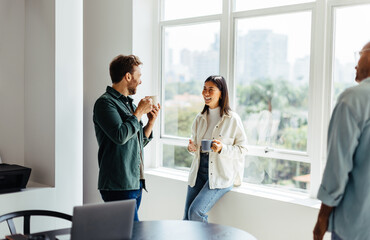 Poster - Happy business people having a coffee break in an office