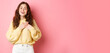 © Mix and Match Studio - Portrait of cute heartfelt girl appreciate nice gesture, being praised, holding hands on heart and sighing from romantic feelings, looking grateful, say thank you, standing over pink background