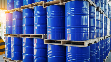 Blue barrel drum on the pallets contain liquid chemical in warehouse prepare for delivery to customer by made to order. Manufacture of chemicals production. Oil and chemical industrial works concept