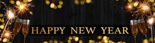 HAPPY NEW YEAR 2023 Celebration Holiday Greeting Card Background Banner - Toasting Champagne Or Sparkling Wine Glasses And Sparklers On Black Wooden Wall Texture