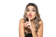 © vladimirfloyd - cute woman with long wavy hair holding her finger on her mouth as she was keeping a secret on a white background