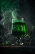 Green poison in the glass. Toxic concept