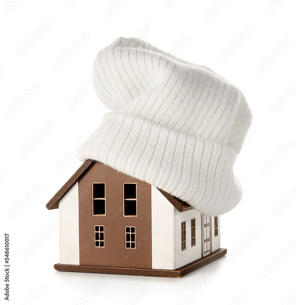 House model with hat on white background. Heating concept