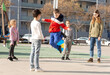 © JackF - Happy smiling little friends playing with chinese jumping rope at playground. High quality photo