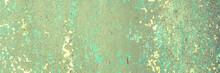 Peeling Paint On The Wall. Panorama Of A Concrete Wall With Old Cracked Flaking Paint. Weathered Rough Painted Surface With Patterns Of Cracks And Peeling. Wide Panoramic Texture For Grunge Background