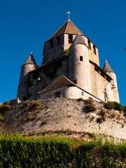 Wall Mural - External low angle view of Caesar Tower over deep blue sky. Provins, France.