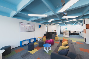 Photo of a modern office where programming, digital marketing and web design projects are done. Office with modern furniture and glass office