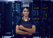 © Tetra Images - Portrait of smiling female technician in server room
