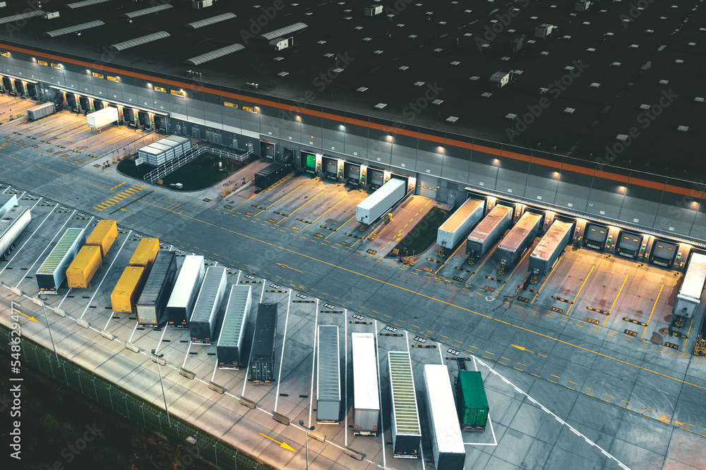 Top view of many trailers and containers near the logistics warehouse ...