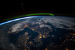 © Blue - Aerial view from above Earth showing Scandinavia at night. Green aurora above the northern Baltic Sea. Image courtesy of the Earth Science and Remote Sensing Unit, NASA Johnson Space Center.