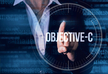 Wall Mural - business woman with finger pressing objective-c button on virtual screens. modern technology concept