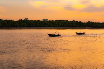 Poster - Mesmerizing soft sunset over the calm coastline of Danga bay with ships on the water