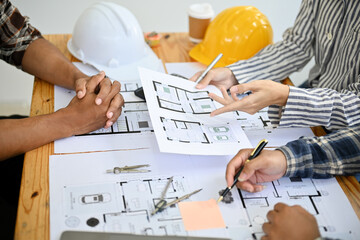 Wall Mural - team of professional asian construction engineer and architect discussing, working together
